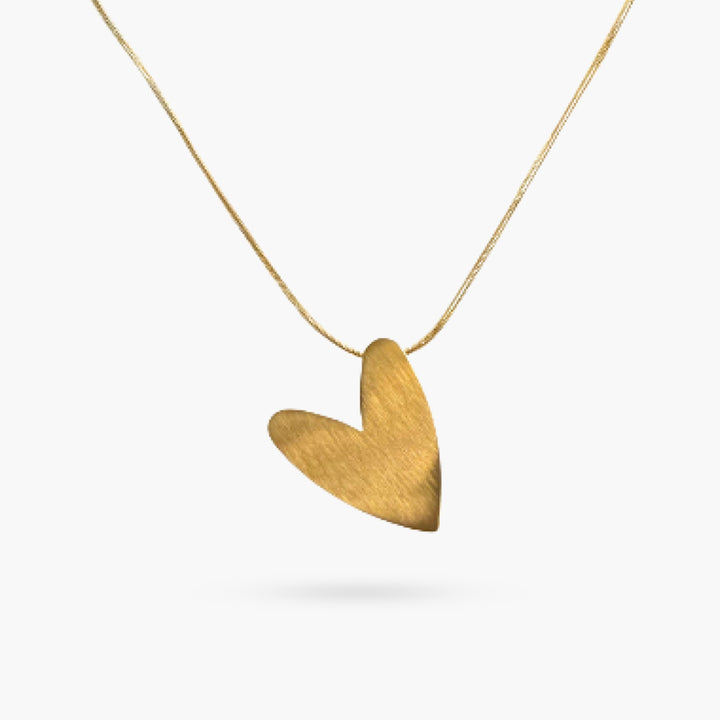 The Tilted Gold Heart on a Snake Chain